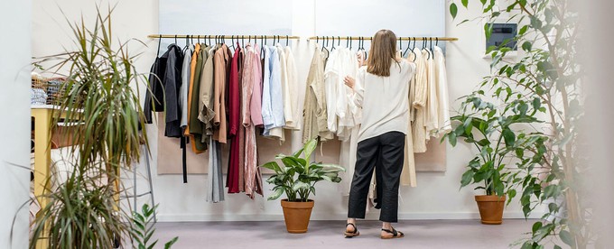 Consumer finding ethical clothing in a concept store