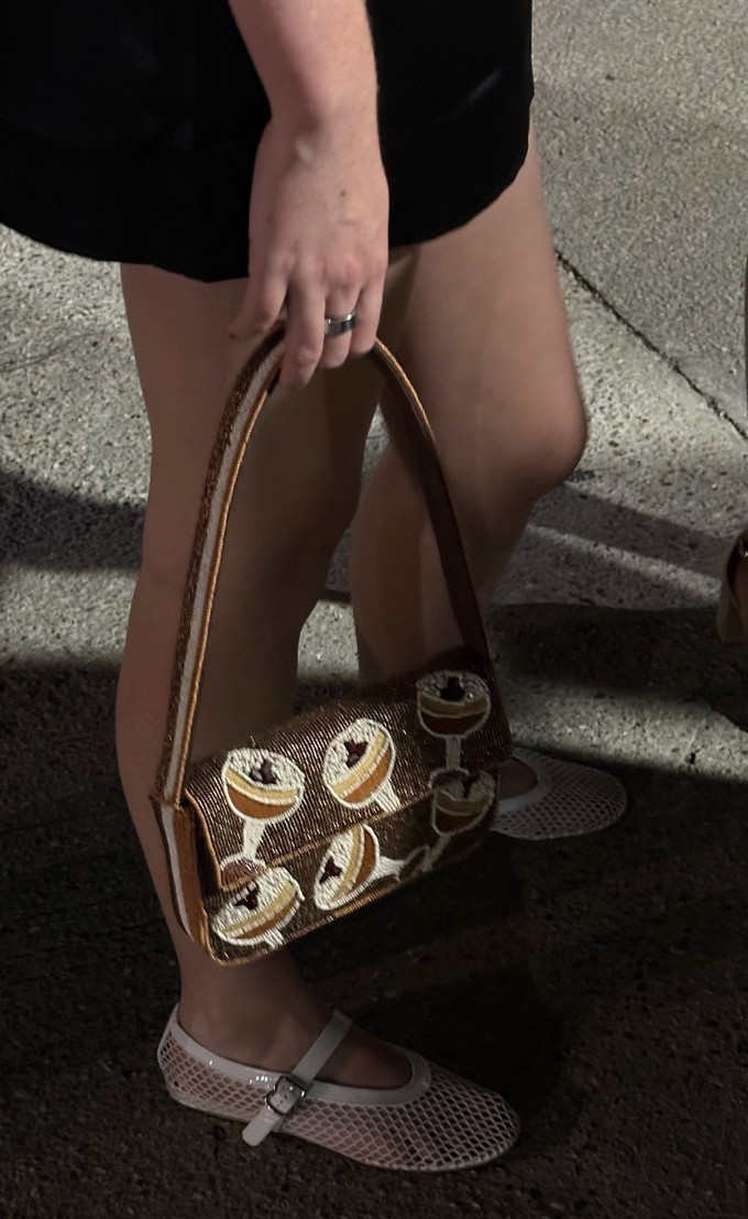 Consumer rocking sustainable accessories like a bag and shoes
