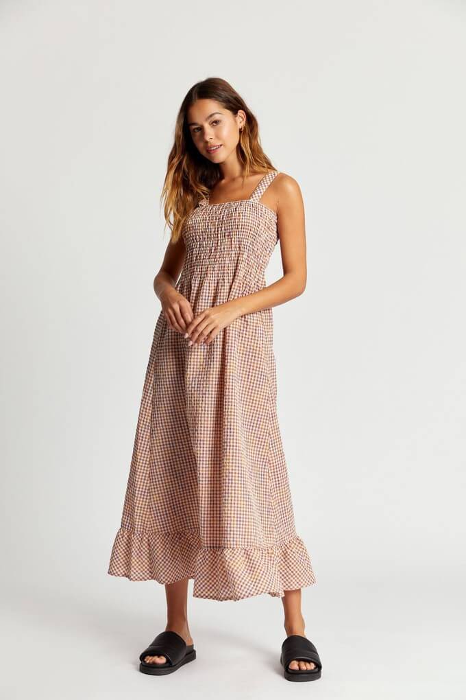Consumer showcasing an ethical dress with a low cost per wear