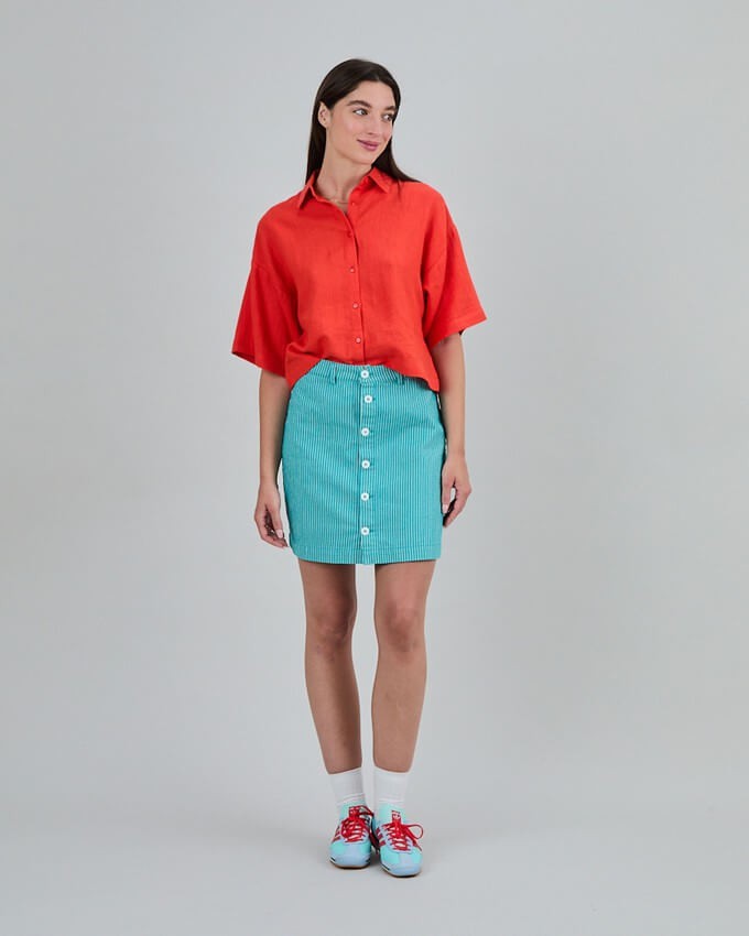 Consumer wearing a bright sustainable skirt