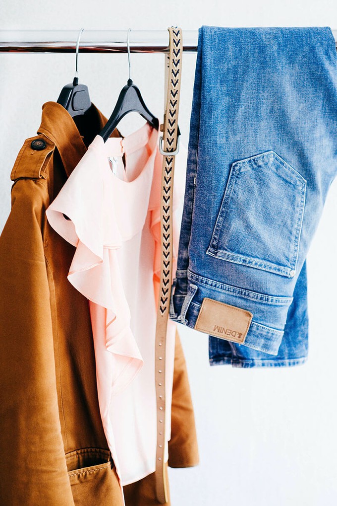 Garments on a rack during a sustainable clothing swap party