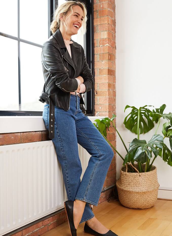 Model wearing a sustainable real leather jacket made with vegetable tanning