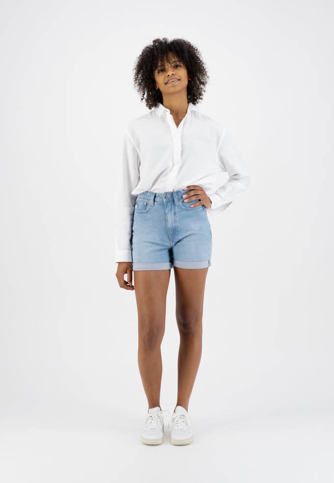 Model wearing ethical denim shorts