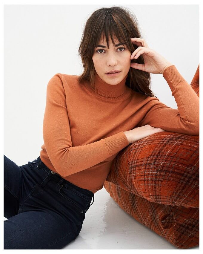 Woman wearing a turtleneck as an ethical autumn capsule wardrobe staple