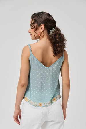 Deep V-Neck Polka Dot Top with Bow Detail from Reistor